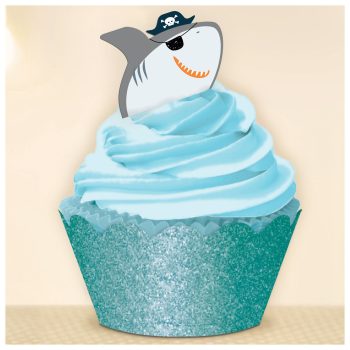 Cupcake with blue icing and shark topper.