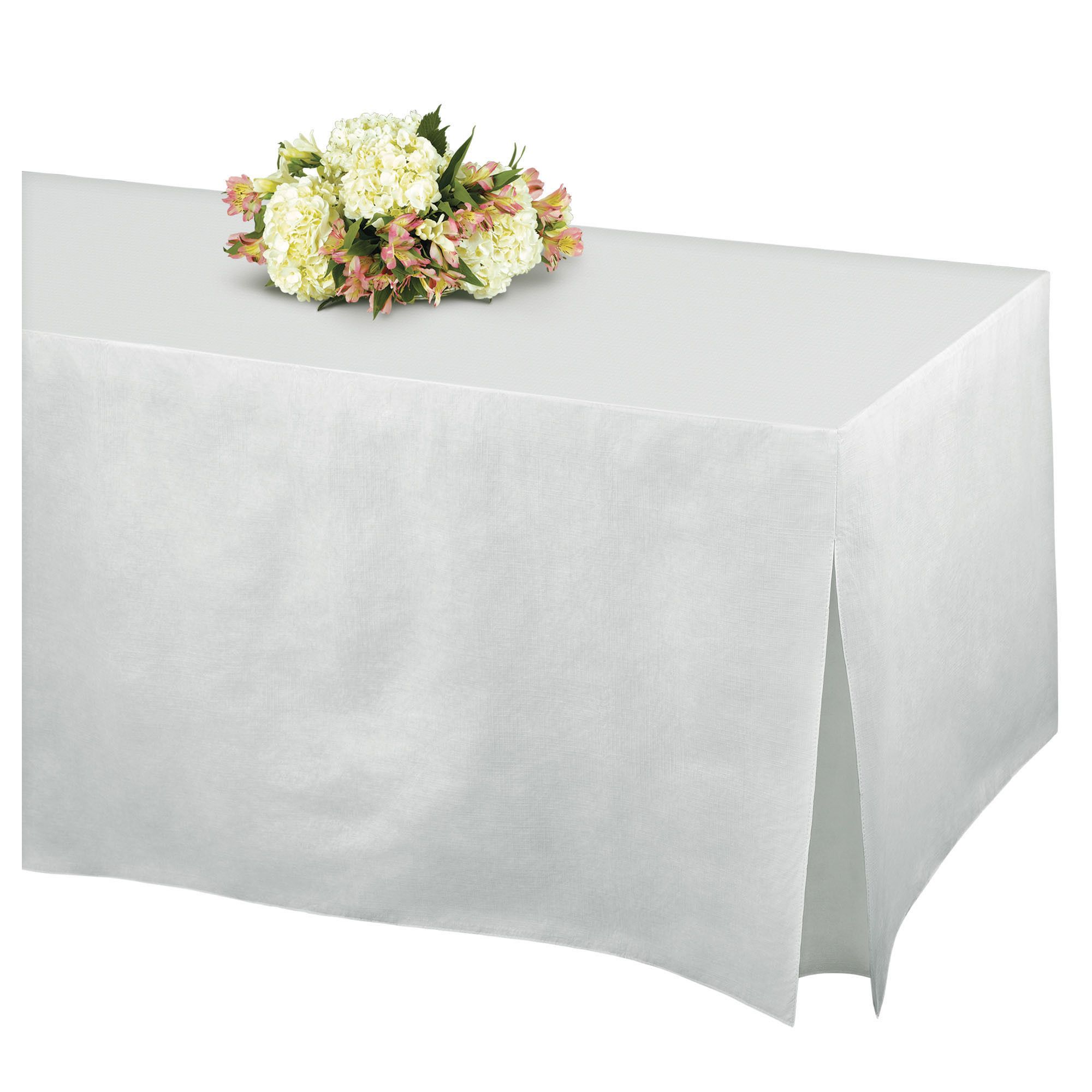 White tablecloth with floral centerpiece.