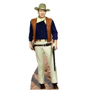 Cowboy in hat and western attire standing.