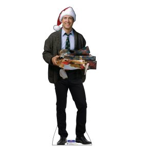 Man in Santa hat holding Christmas gifts.