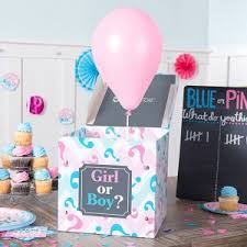 Gender reveal party with pink balloon.
