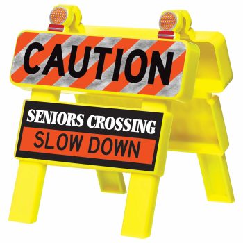 Yellow caution sign: seniors crossing, slow down.