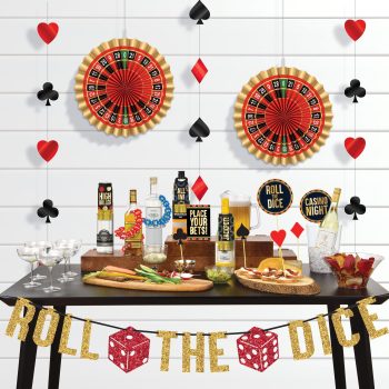 Elegant casino-themed party setup with poker chips and card symbols.