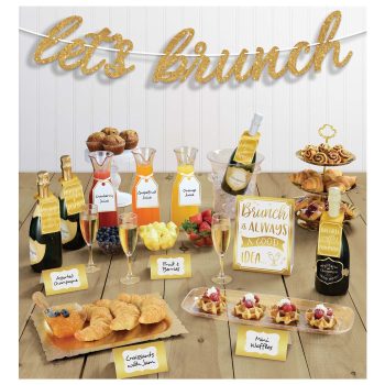 Brunch buffet with drinks and pastries display.