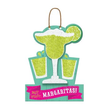 Decorative sign shaped like a margarita glass with limes and text.