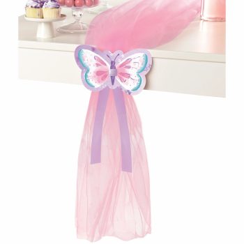 Pink butterfly-themed party table decoration.