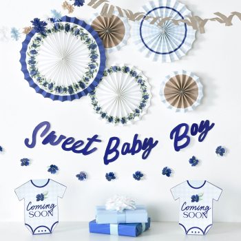 Blue and white baby shower decorations with "Sweet Baby Boy" lettering.