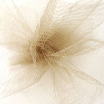 Soft beige tulle fabric arranged in delicate folds.