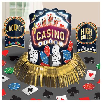 A festive casino-themed centerpiece with poker chips and cards.