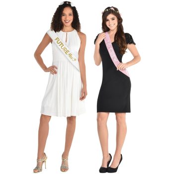 Two women in dresses wearing pageant sashes and tiaras.