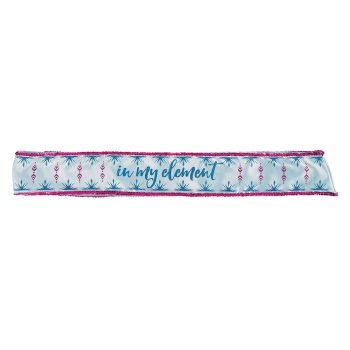 Blue and pink sash with decorative design.