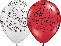 Red and white balloons decorated with black heart patterns.