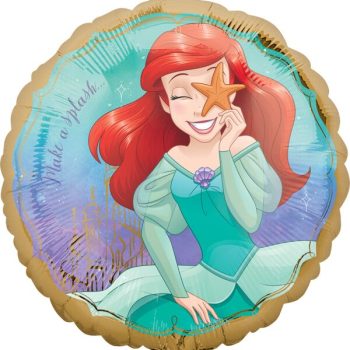 Ariel, the red-haired mermaid, smiling and holding a starfish on her face.