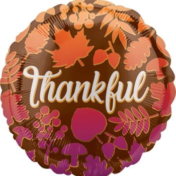 A round balloon with autumn leaves and 'thankful' text.