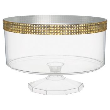 Clear cake stand with gold decorative rim.