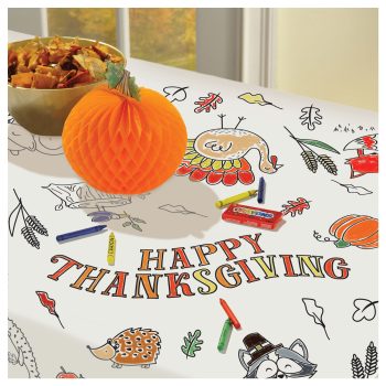 Thanksgiving table with decorations and snacks.