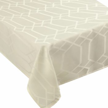 White geometric-patterned tablecloth on table.