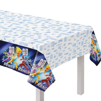 Power Rangers themed tablecloth on white table.