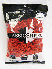 Red plastic shredding material in a clear bag labeled Classic Shred.