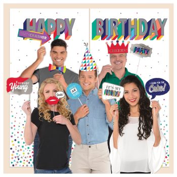 Group celebrating birthday with fun props.