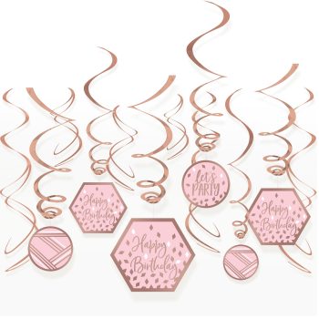 Pink birthday decorations with swirling ribbons.