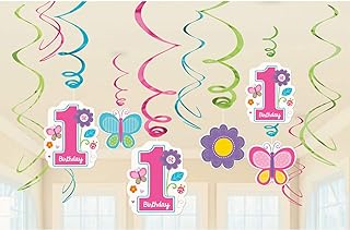 Colorful 1st birthday decorations with butterflies and flowers.