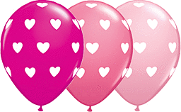 Three heart-patterned balloons in shades of pink and red.