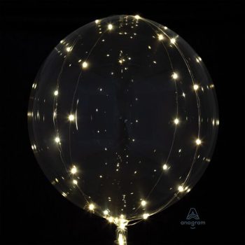A transparent balloon adorned with small, glowing string lights against a dark background.
