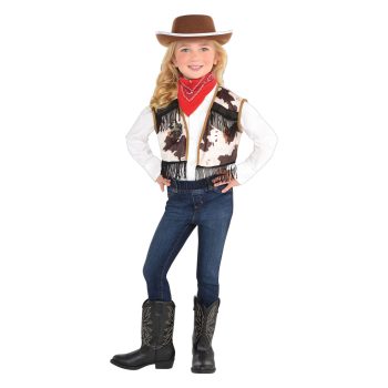 Child in cowboy outfit with hat smiling.