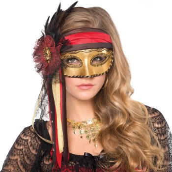 Woman wearing ornate gold and red mask.