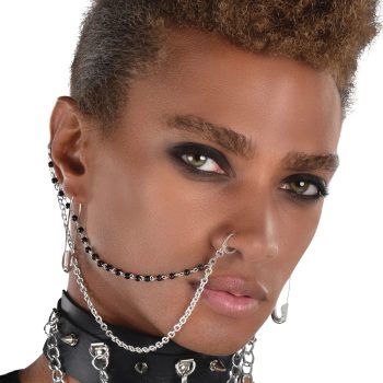 Person wearing chains and dark eye makeup.