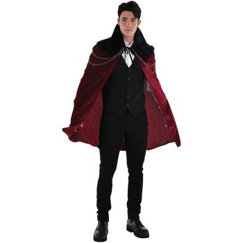 Man in vampire costume with red cape.