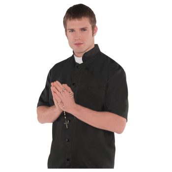 Man holding rosary beads, wearing clerical shirt.