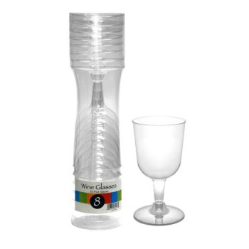 Transparent plastic disposable cups stacked in a container with one cup separate.