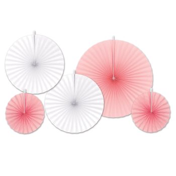 Decorative paper fans in white and pink arranged on a wall.