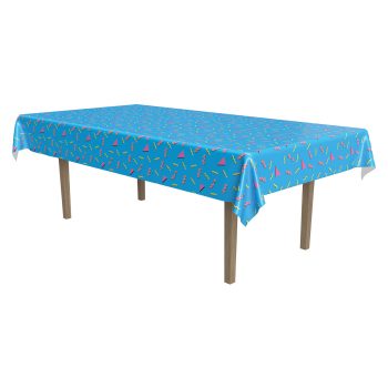 Rectangular table covered with a blue patterned tablecloth.