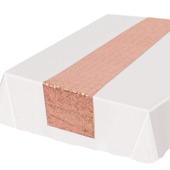 White tablecloth with a decorative rose gold lace runner.