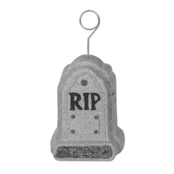 Gray tombstone decoration with RIP and a spiral holder on top.