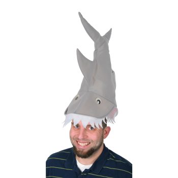 Man wearing a humorous shark hat, smiling.