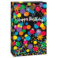 Colorful birthday gift bag with cheerful polka dots and flowers.