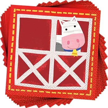 Red party napkins with a cute cartoon cow and barn design.