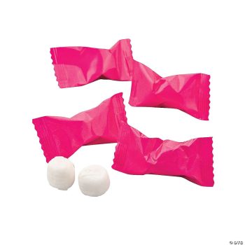 Pink-wrapped mints with two unwrapped white mints beside them.