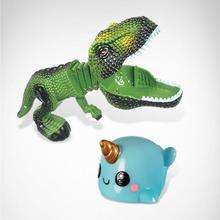Two cute animal-shaped toys: a green crocodile and a blue narwhal.