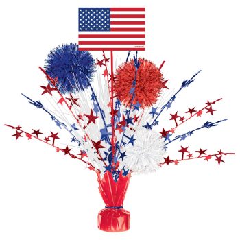 Patriotic centerpiece with red, white, and blue decorations and American flag.